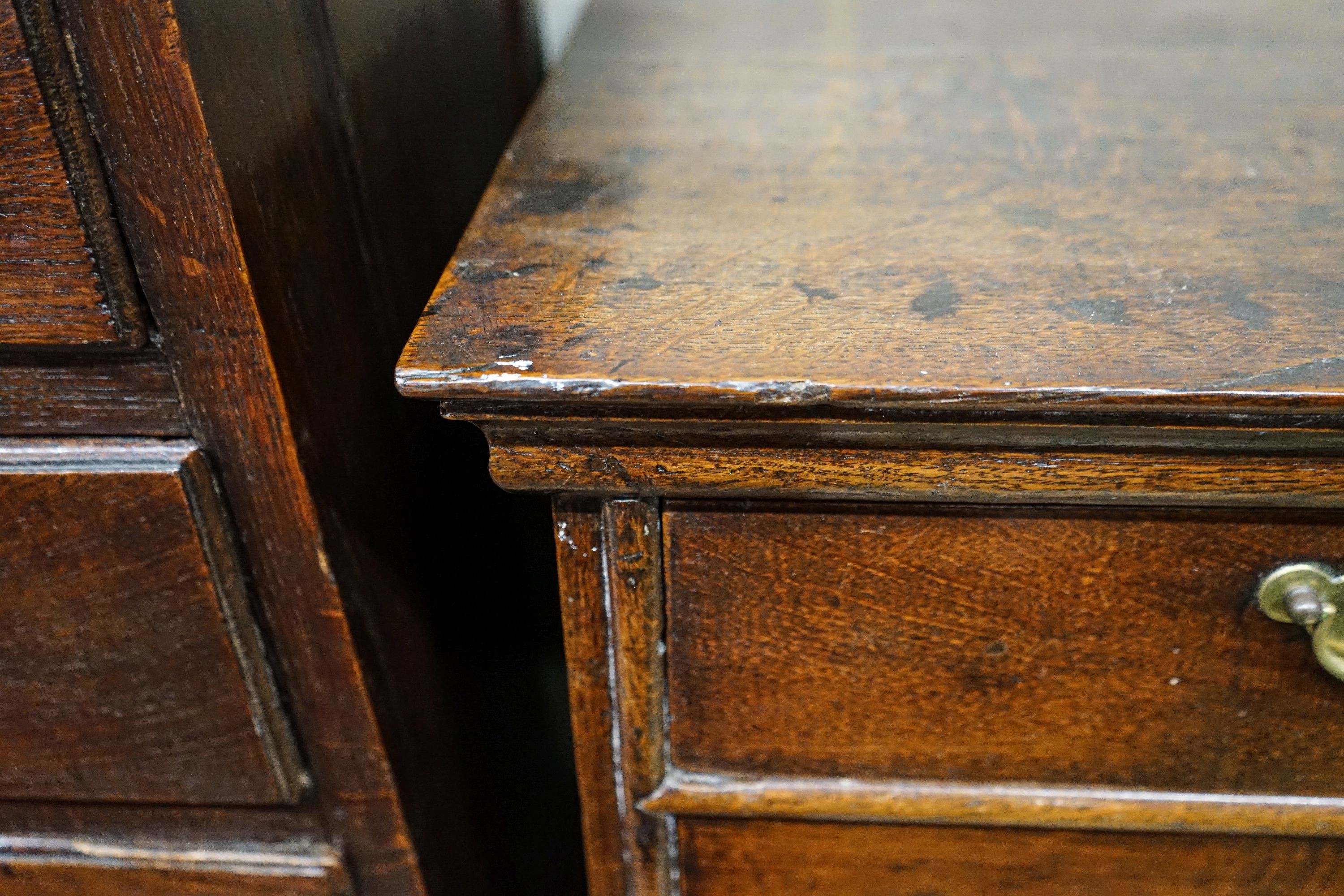 An early 18th century oak chest on stand, fitted two short and four long drawers, width 106cm, depth 56cm, height 117cm